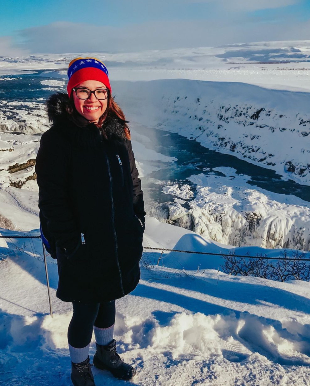 Alexandra Wuyke - Boston artist stands on a mountain covered in snow.