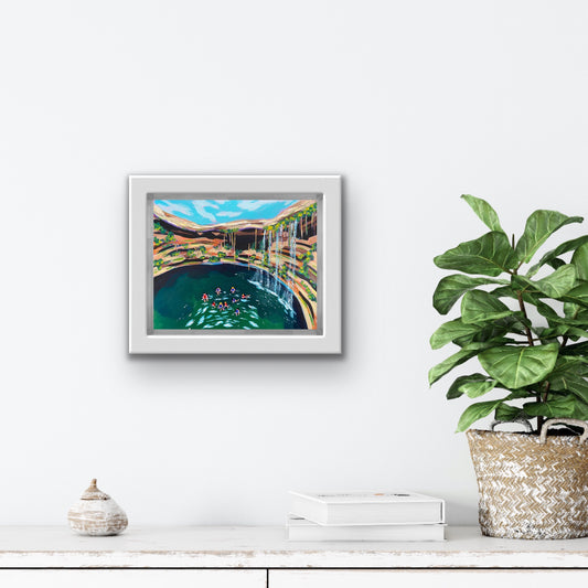 Boston Latinx Travel Artist Alexandra Wuyke Art "Cenote" hangs on a white wall.